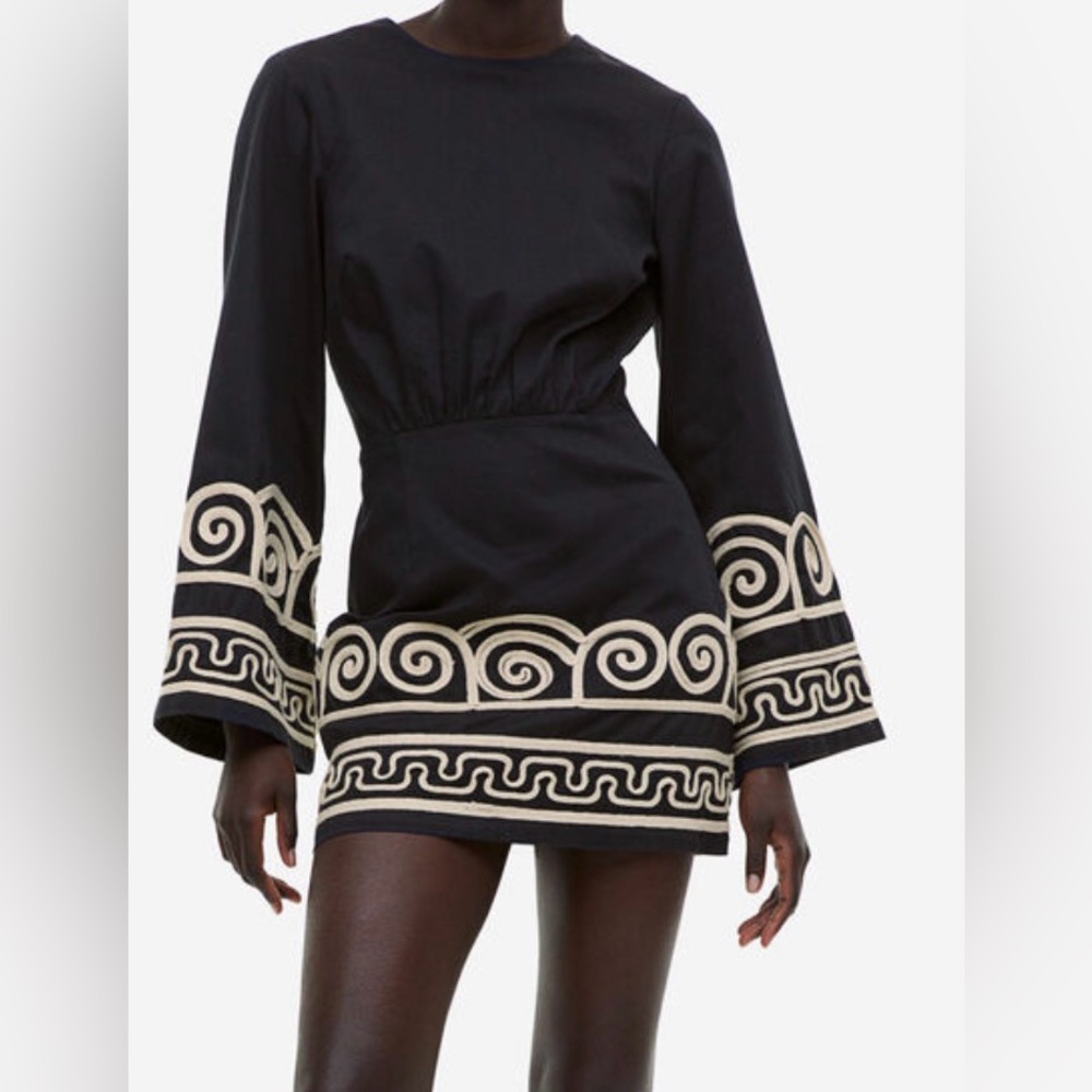 Black Mini Dress with Cream Scroll Embroidery.
Lyocell blend